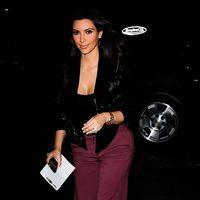 Kim Kardashian smiling while on her way to visit friend Jonathan Cheban